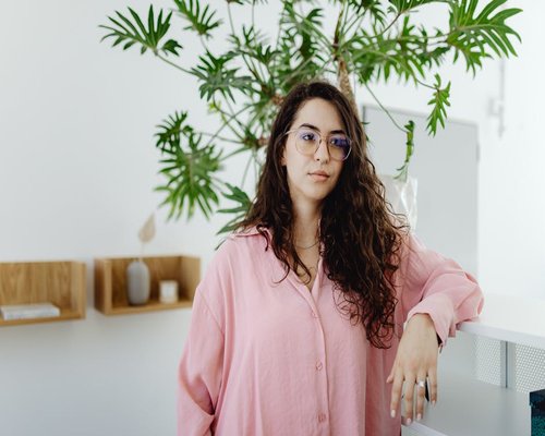 Woman maintaining correct posture at desk